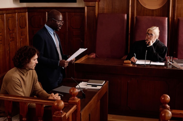 A courtroom scene with a gavel and legal documents, symbolizing the legal framework of labor laws and the importance of understanding the changes.