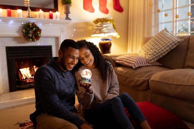 Family using energy-efficient light bulbs in their living room, showcasing sustainable living.