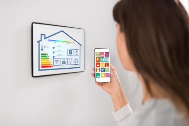 Smart home setup with energy monitoring devices, showing real-time energy consumption and savings.
