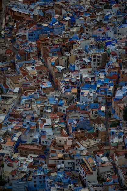 A nighttime aerial view of a large favela in Rio de Janeiro, with visible police presence and activity. The image captures the challenges and complexities of law enforcement in densely populated urban areas with high crime rates.