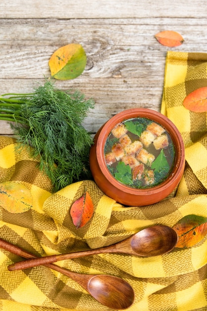 A vibrant Moqueca Baiana served in a clay pot, garnished with cilantro, with a side of white rice. The colors of the ingredients (tomatoes, peppers, fish) are very bright and appealing.