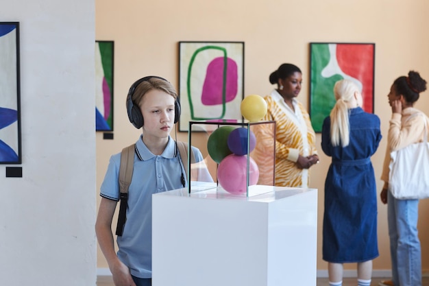 An engaging display at the Catavento Cultural e Educacional, showing children actively participating in a science experiment, surrounded by colorful exhibits.
