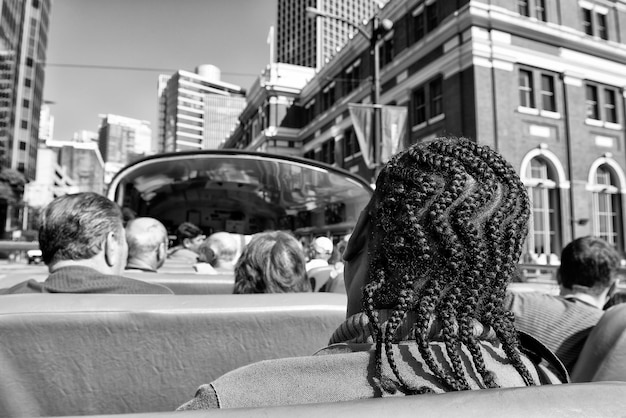 A black-and-white photo depicting a crowded street in Rio de Janeiro during Carnival before the pandemic, highlighting the vibrant and bustling atmosphere of Brazilian cultural events.
