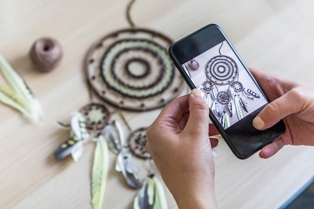 A close up of a Brazilian artisan working on their craft, with social media icons subtly integrated in the background, symbolizing the convergence of traditional craftsmanship and digital promotion.