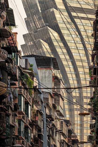 A divided city landscape in Brazil, with luxurious apartments overlooking a favela, visually representing the stark contrast between wealth and poverty in the country.