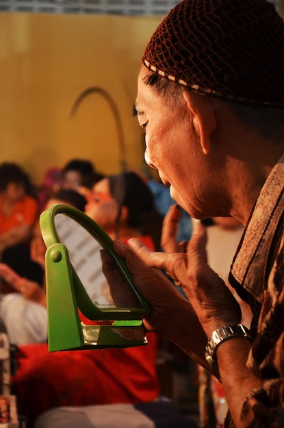 A dynamic photo of a Brazilian social entrepreneur conducting a workshop in a community center, teaching digital skills to young adults, symbolizing empowerment through education and technology.