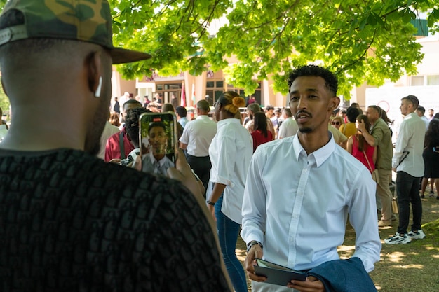 A Brazilian politician is speaking passionately at a community event, surrounded by people of all ages. The image captures a sense of connection and commitment to the local community.