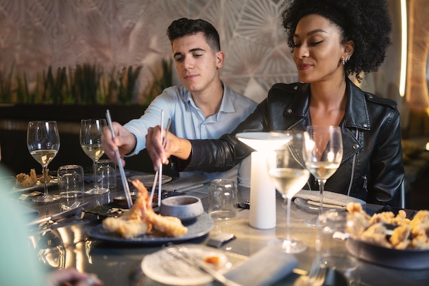 An elegant dining room in a top-rated Brazilian restaurant, filled with patrons enjoying a multi-course meal with wine pairings.